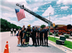 Firefighters Posing for Photo with Fire Truck Displaying American Flag