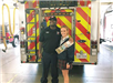 Girl Scout with Member of Fire Department