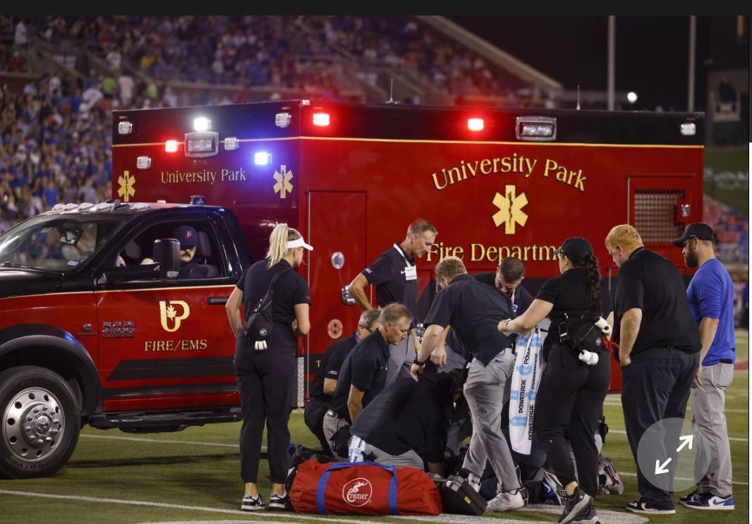 SMU medical team in front of UPFD Ambulance 